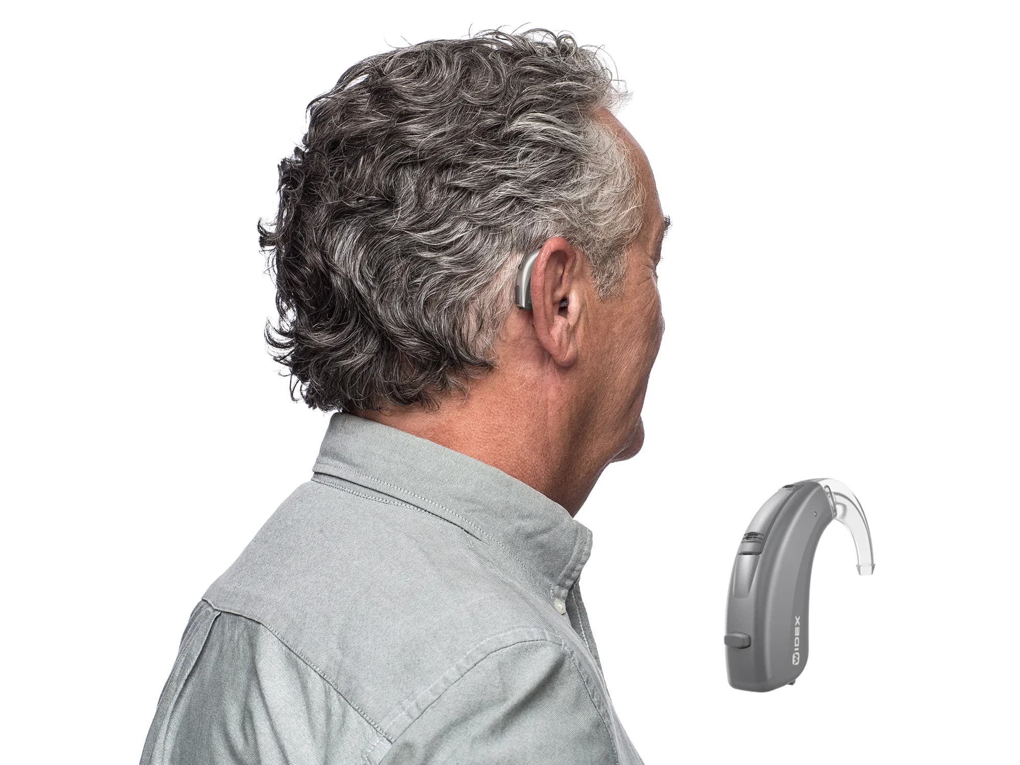 Widex bte behind-the-ear hearing aid worn on the ear to show how discreet it is